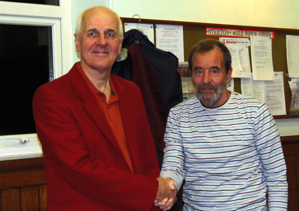 David Brown (right) presents George Hladowski with his red jacket